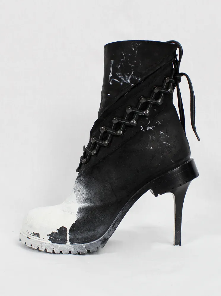 A.F. Vandevorst white spraypainted stiletto combat boots Fall 2015 performance.