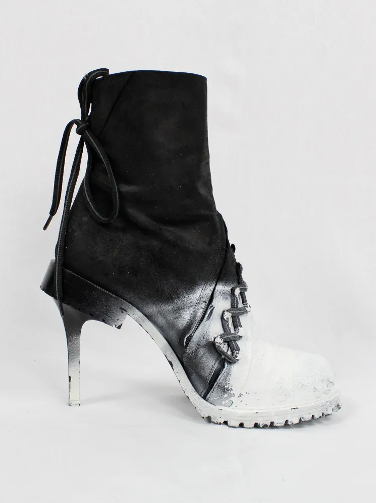 A.F. Vandevorst white spraypainted stiletto combat boots Fall 2015 performance.